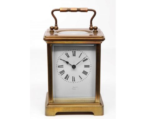 A FRENCH BRASS CARRIAGE TIMEPIECE with white enamel Roman dial and platform lever escapement, 11cm high