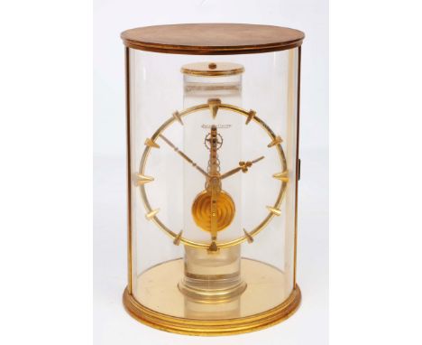 A JAEGER-LE-COULTRE MANTEL TIMEPIECE, the straight line jewelled skeleton movement and gilt brass chapter ring mounted on a f