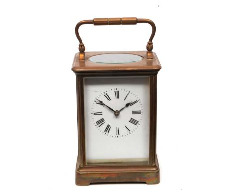 A FRENCH BRASS CASED CARRIAGE CLOCK with white enamel Roman dial, platform escapement and a coiled gong strike within a corni