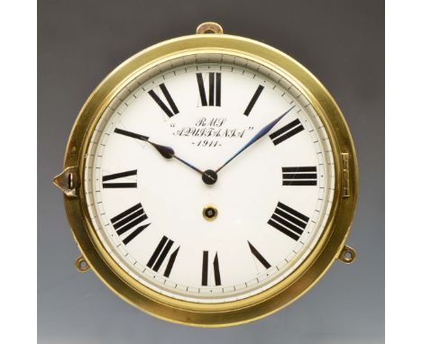 A BRASS SHIPS BULK HEAD TIMEPIECE, the white enamel Roman dial inscribed RMS 'Aquitania', 1911 with fast/slow lever at 12 o'c