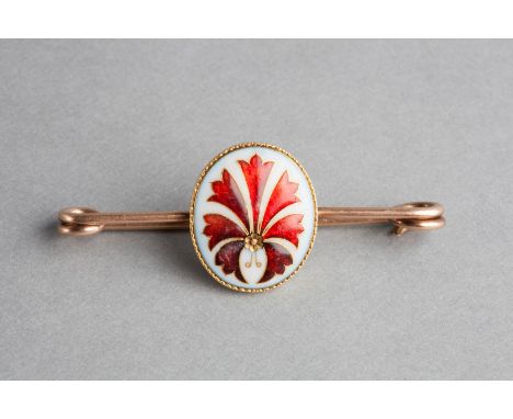AN ENAMEL BROOCH, oval panel depicting a flower and leaves