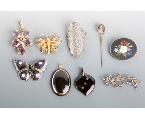 A TORTOISESHELL HEART SHAPED PENDANT with inset stars, a filigree and enamel butterfly brooch, an enamel butterfly brooch, a 