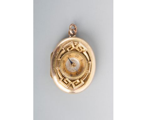 A VICTORIAN OVAL LOCKET with engraved foliate decoration and with an inset compass verso