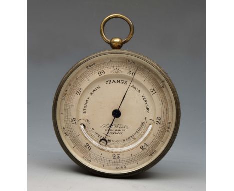A TRAVELLERS ANEROID BAROMETER, the two piece silvered dial signed F L.. West, 31 Cockspur St., London with curved mercury tu