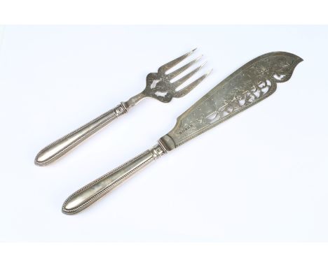 A PAIR OF VICTORIAN SILVER FISH SERVERS with silver blade, pierced and engraved scroll decorated blade and beaded handle, 33c