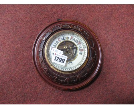 A Late XIX Century Mahogany Wall Barometer, the circular carved case with cream enamel dial and black/red lettering and numbe