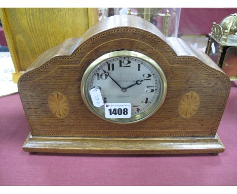 An Edwardian Oak Mantel Clock, with batwing inlay, the face marked Charles E. Rose, Halifax, with wind-up movement, 28.5cm wi
