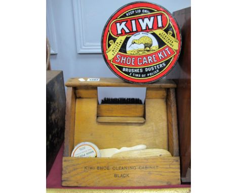 A Vintage Wooden Kiwi Shoe Cleaning Cabinet, for black and brown shoes 27.5cm wide; together with a large Kiwi tin, brushes, 