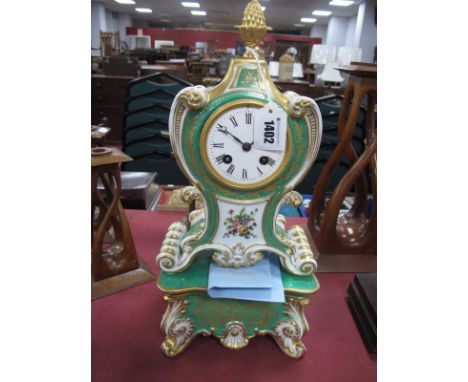 A French Porcelain Cased Mantel Clock, the rococco style case raised upon a rectangular scrolling plinth base, the green grou