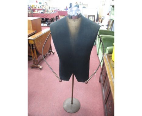 A Circa 1940's/50's Shop Mannequin, featuring a chrome capped black male upper body with flexible wire arms on a heavy metal 