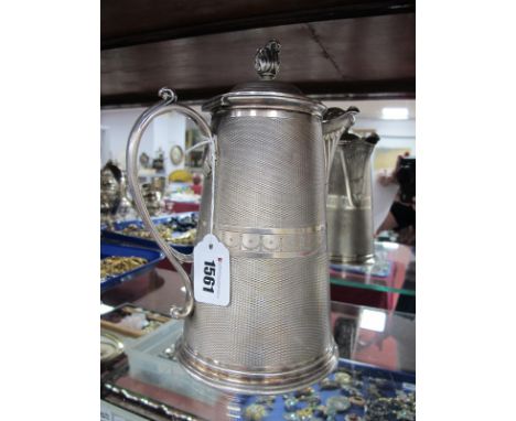 A c.XIX Century French Plated Flagon, of tapering cylindrical form, allover engine turned, with decorative spout, the hinged 