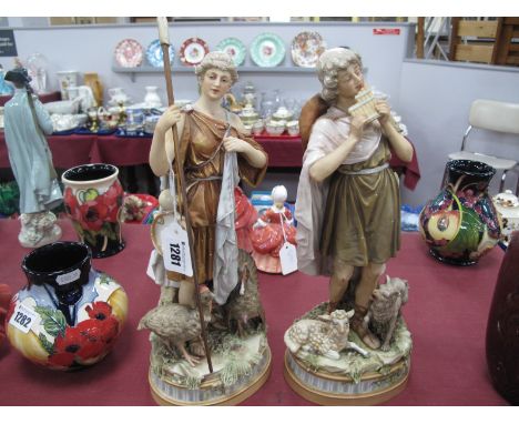 A Pair of Royal Dux Early XX Century Pottery Figures of Peasants, she standing beside a turkey carrying a flask and a tambour