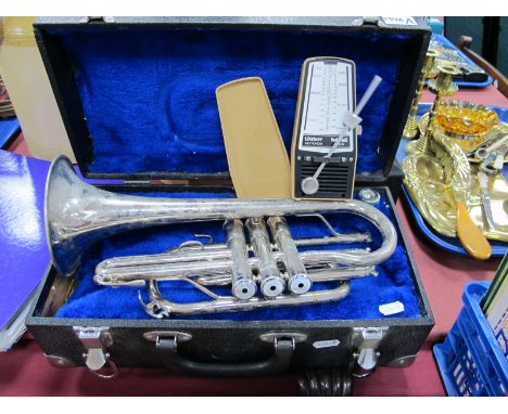 A Cornet, cased and a Taktell Junior metronome. (2)
