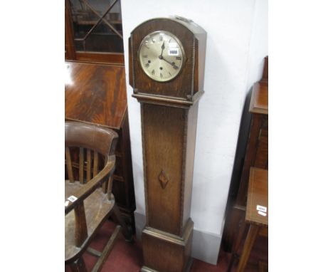 1920's Oak Grandmother Clock, with a circular dial, Roman numerals, on bracket feet.