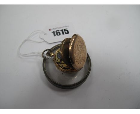 A Ladies Fob Watch, the engine turned dial with black Roman numerals, within leaf scroll engraved case, stamped "K9".