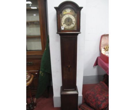 1920's Tempus Fugit Musical Grandfather Clock, with a arched hood, silvered dial Roman numerals, trunk with applied base on b