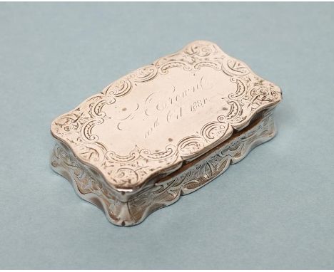 A VICTORIAN SILVER SNUFF BOX, maker Hilliard &amp; Thomason, Birmingham 1882, of shaped oblong form, bright cut engraved with