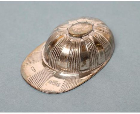 AN EDWARDIAN SILVER JOCKEY CAP CADDY SPOON, maker probably William Neal, Birmingham 1909, with engine turned stripes, 2 1/4" 