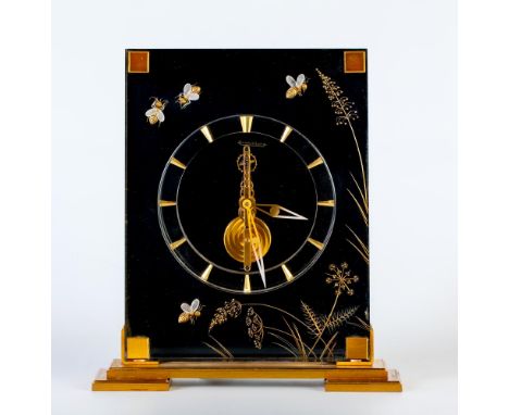 A JAEGER LECOULTRE GILT METAL AND PERSPEX MYSTERY TIMEPIECE, the wind up exposed wheel driven spring balance movement stamped