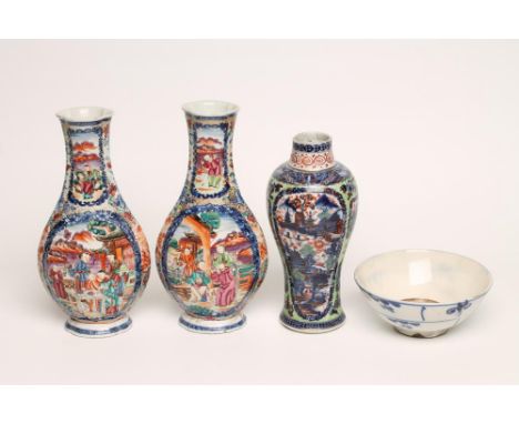 A PAIR OF CHINESE VASES of lobed flattened baluster form, painted in underglaze blue with panels of figures, clobbered in col