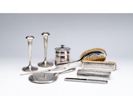 A COMPOSITE SEVEN PIECE ARTS AND CRAFTS SILVER DRESSING TABLE SET, maker Liberty &amp; Co., Birmingham marks, each piece heav