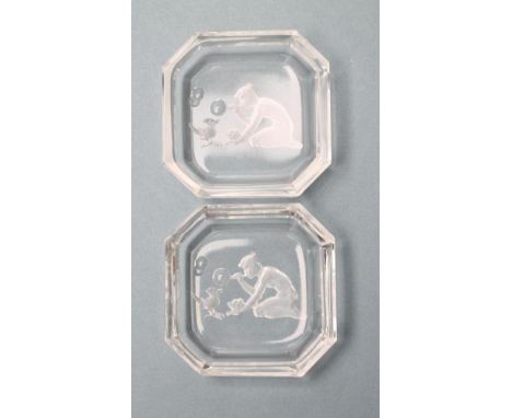 A PAIR OF DRESSING TABLE DISHES of canted square form, intaglio moulded with a naked art deco maiden blowing bubbles to a bir