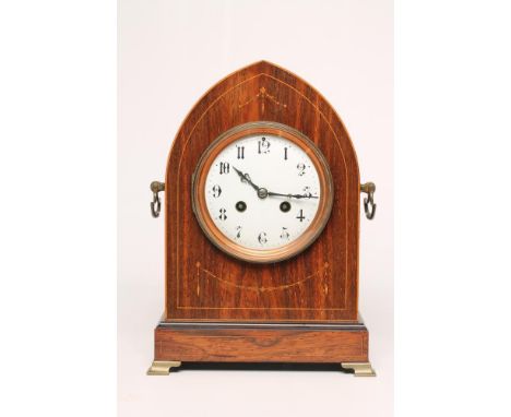 AN EDWARDIAN ROSEWOOD CASED TABLE CLOCK, the twin barrel movement striking on a gong, 4 1/4" enamel dial with Arabic numerals