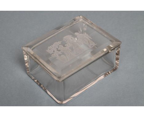 A BOX AND COVER of plain canted oblong form, the cover intaglio moulded with three classical figures beneath a tree, bears R.
