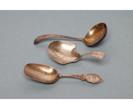 A LATE GEORGE III SILVER CADDY SPOON, maker Joseph Taylor, Birmingham 1803, the shield bowl wrigglework engraved with a vacan