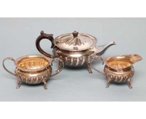 A LATE VICTORIAN BACHELOR'S SILVER THREE PIECE TEA SERVICE, maker Barraclough &amp; Barraclough, Sheffield 1896, of semi-wryt