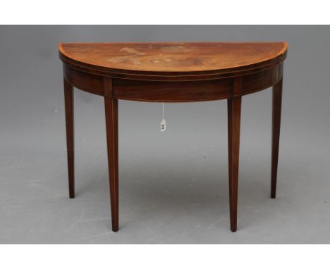 A GEORGIAN MAHOGANY FOLDING CARD TABLE, late 18th century, of demi lune form crossbanded with stringing, green baize lining, 