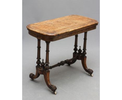 A VICTORIAN BURR WALNUT FOLDING CARD TABLE, of rounded oblong form with stringing, the banded swivel top with foliate corner 