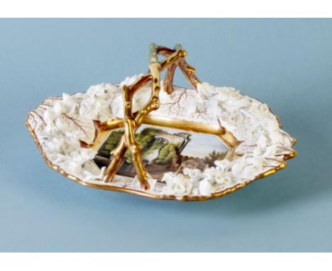 A ROCKINGHAM PORCELAIN BASKET, c.1835, of canted oblong form with fixed entwined twig handle, centrally painted in polychrome