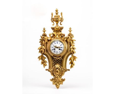 A FRENCH GILT METAL CARTEL CLOCK by Japy Freres, the twin barrel movement striking on a bell, the 4 1/2" white enamel dial wi