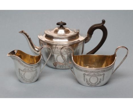 A LATE VICTORIAN SILVER THREE PIECE TEA SERVICE, maker Martin, Hall &amp; Co., Sheffield 1900, of oval form with bright cut e