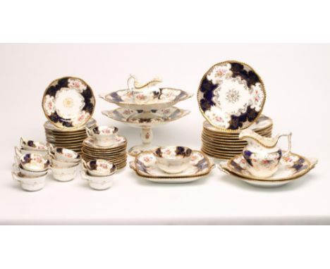 A COALPORT CHINA PART TEA AND DESSERT SERVICE, c.1920, printed and overpainted in colours with the "Batwing" pattern with cob