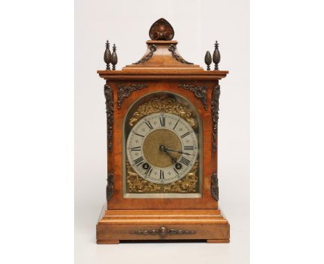 A WALNUT CASED TABLE CLOCK by Lenzkirch, the twin barrel movement with ting tang quarter striking on two gongs, backplate sta
