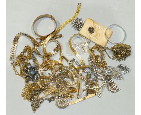 A gold-plated hinged bangle and a quantity of costume jewellery.