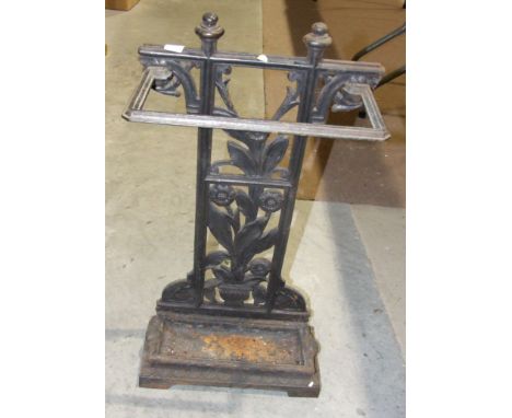A wrought iron stick stand, 63cm high, 33.5cm wide.