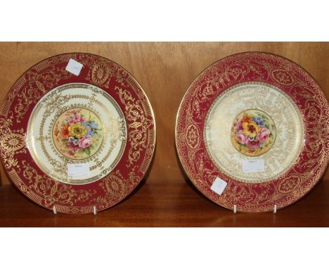 A Royal Worcester cabinet plate by John Freeman painted with circular central panel of flowers within a raised gilt and cream