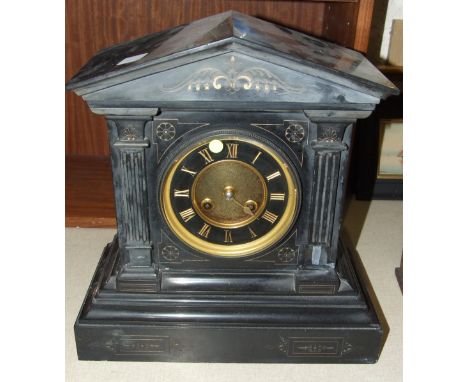 A late-19th century black slate clock of architectural form, the movement stamped 'S Marti', striking on a bell, 34cm high, 3