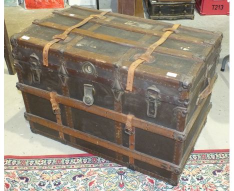 A wood and metal-bound canvas travelling trunk, 92cm wide.
