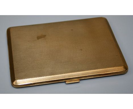 An early 20th century heavily made 9ct yellow gold rectangular cigarette case with engine turned decoration and 1930's presen