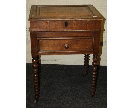 ***RE OFFER FEB 6TH £30-40***An early 20th century oak canteen, converted to an artists cabinet with missing lid enclosing pr