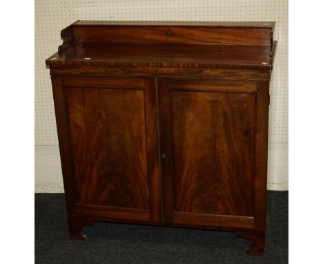A 19th century mahogany chiffonier with a hinged upstand over a pair of paneled doors enclosing shelf and single drawer, on b