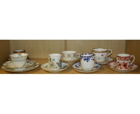 A small collection of trios, cabinet cups and saucers including Coalport, Limoges, Doulton, Wedgwood and other factories.