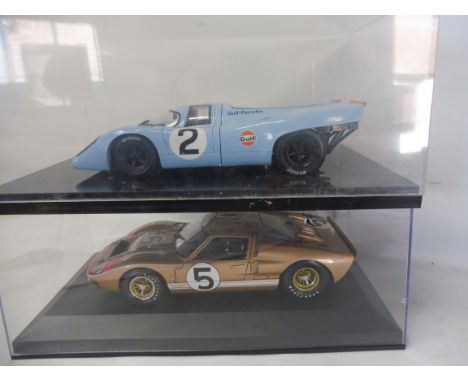 A 1:18 scale Racing Legends Ford G148 Mk. 11 and a Porsche 917.