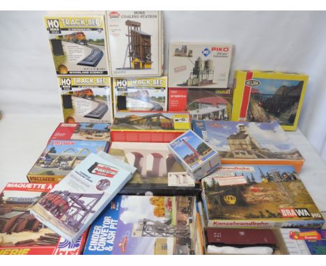 A large box of boxed model railway buildings, accessories etc.