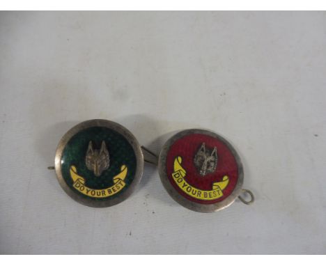 Two enamel and white metal lapel badges, bearing a fox head, both with the motto 'Do your best'.