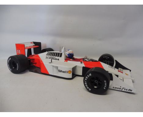 An Ayrton Senna Collection McLaren mp 4/4 and a Honda v6 Turbo 1988, 1:12 scale.